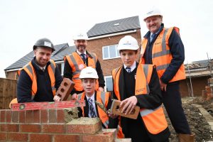 Daniel Robinson, Site Manager at Byron Mews; Mr. Hugh McCracken, teacher; students, Travis Crowle and Stefen Avadanai and Geoff Scott. 